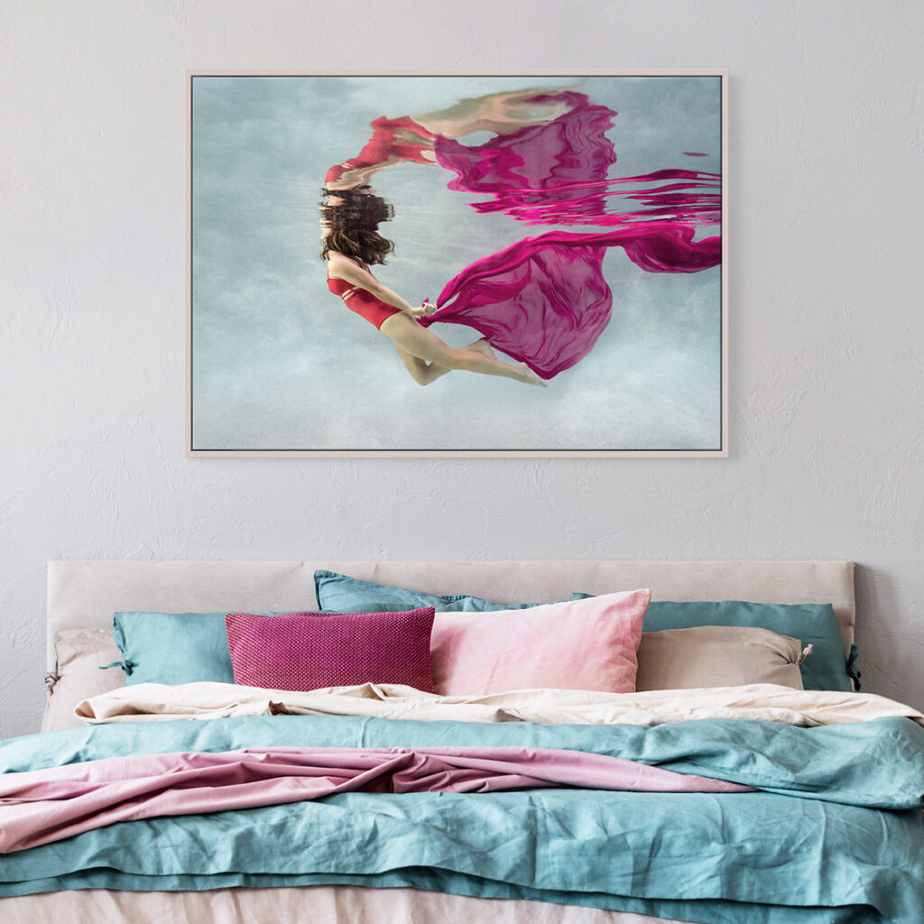 underwater portrait in a framed canvas on the wall in a stylish bedroom