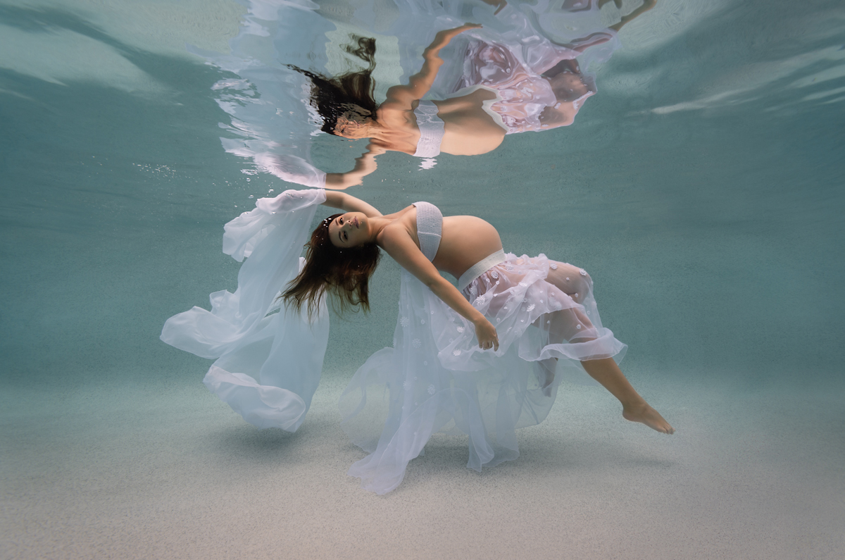 pregnancy woman floating underwater