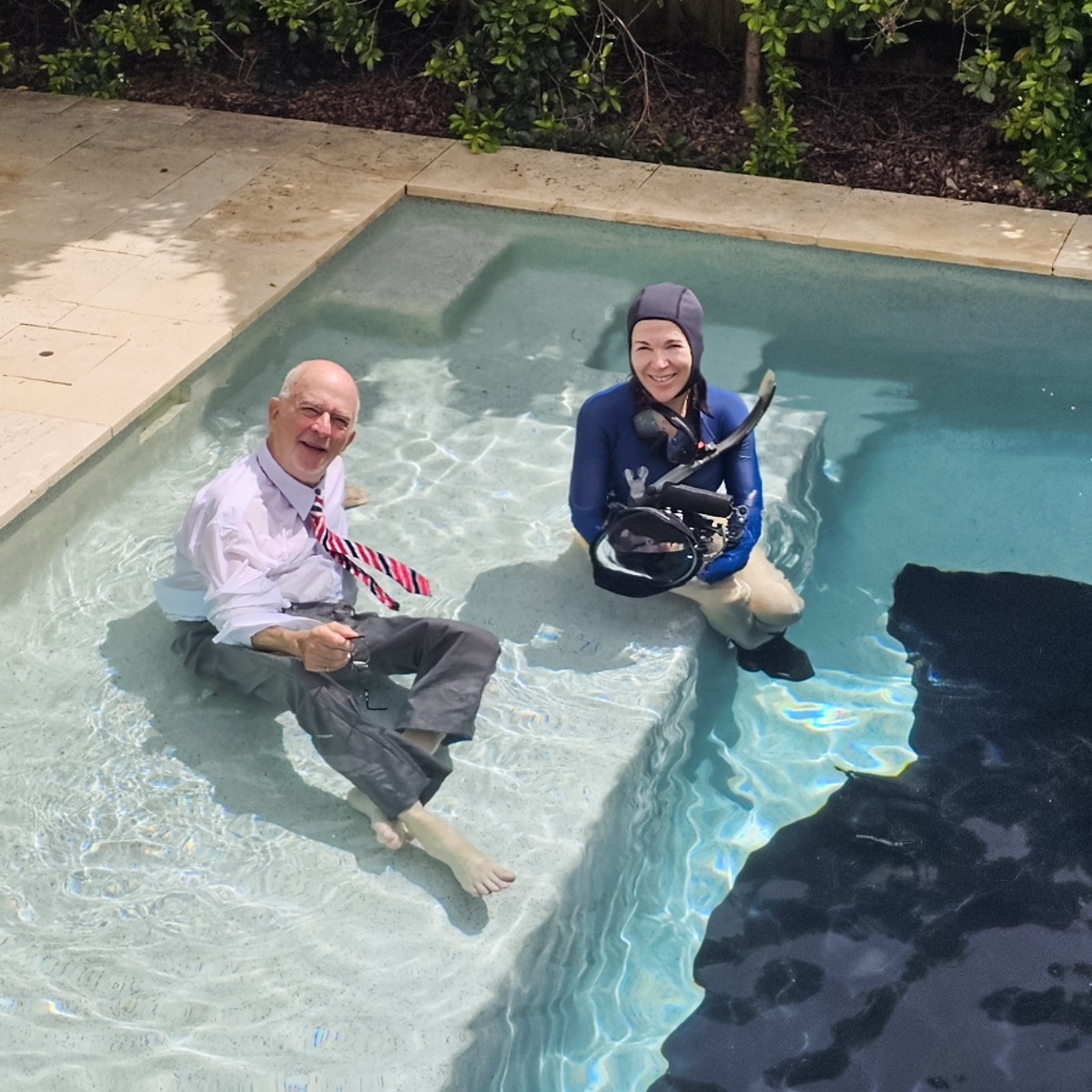 underwater photographer and client in the pool studio, Noosa